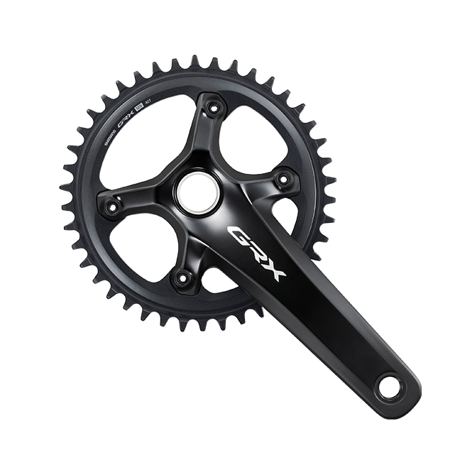 Shimano GRX crankset with chainrings on white background