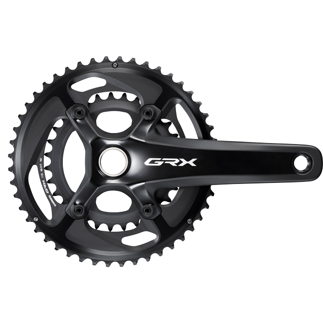 Shimano GRX crankset with chainrings on white background