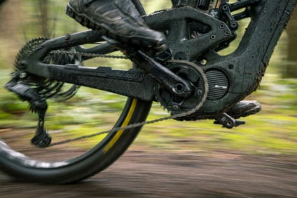 Close-up of a mountain bike in motion on a dirt trail