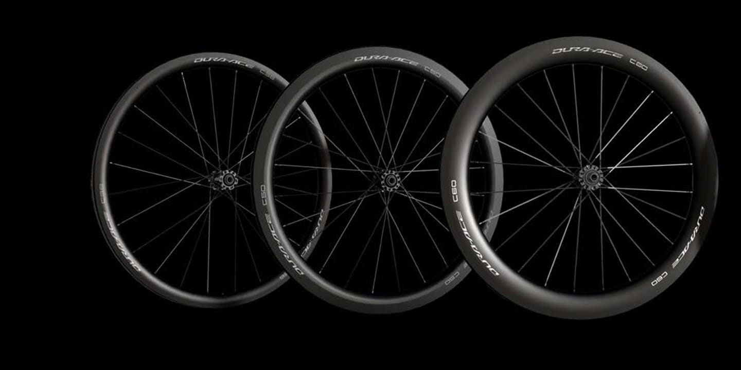 Three Shimano Dura-Ace C50 and C60 bike wheels displayed against a black background