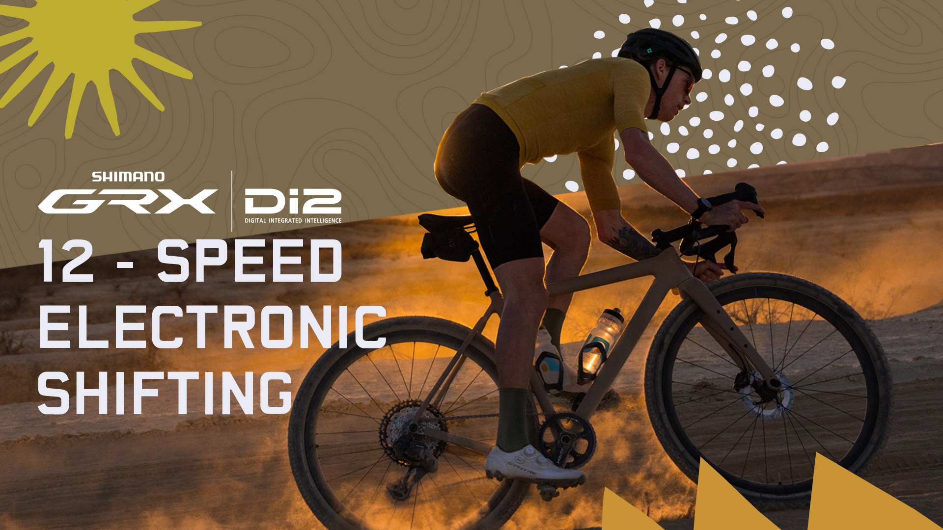 Kaksi pyöräilijää ajaa hiekkapolulla, tekstissä lukee GRX Di2 12-Speed ja Shimano-logo
