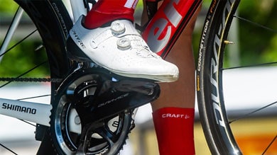 Close-up of cyclist's shoe on a pedal of a road bike with Shimano components