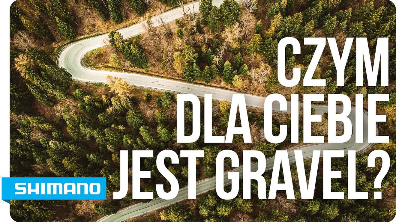 Kręta droga przez las, tekst „Czym dla Ciebie jest Gravel?” i logo Shimano.