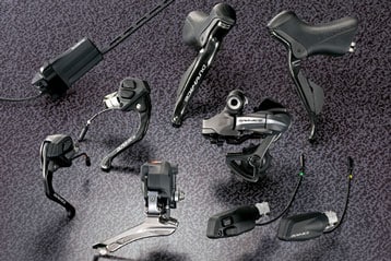 Assorted bicycle components on a textured surface