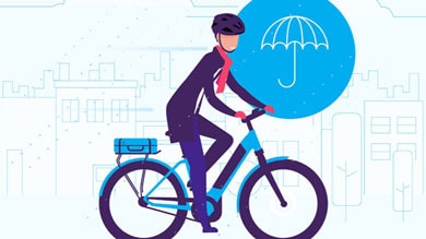 Illustration of a person riding a bike through the city in the rain