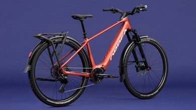 Red Orbea electric bike against a blue background