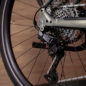 Close-up of a bicycle's rear derailleur and cassette gear system