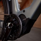 Close-up of a bicycle's Shimano EP6 motor and crankset