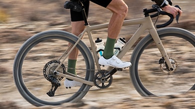 Man riding a Shimano GRX RX827 Wireless Di2 gravel bike in the Arizona desert