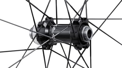 Close-up of a black bicycle hub with spokes