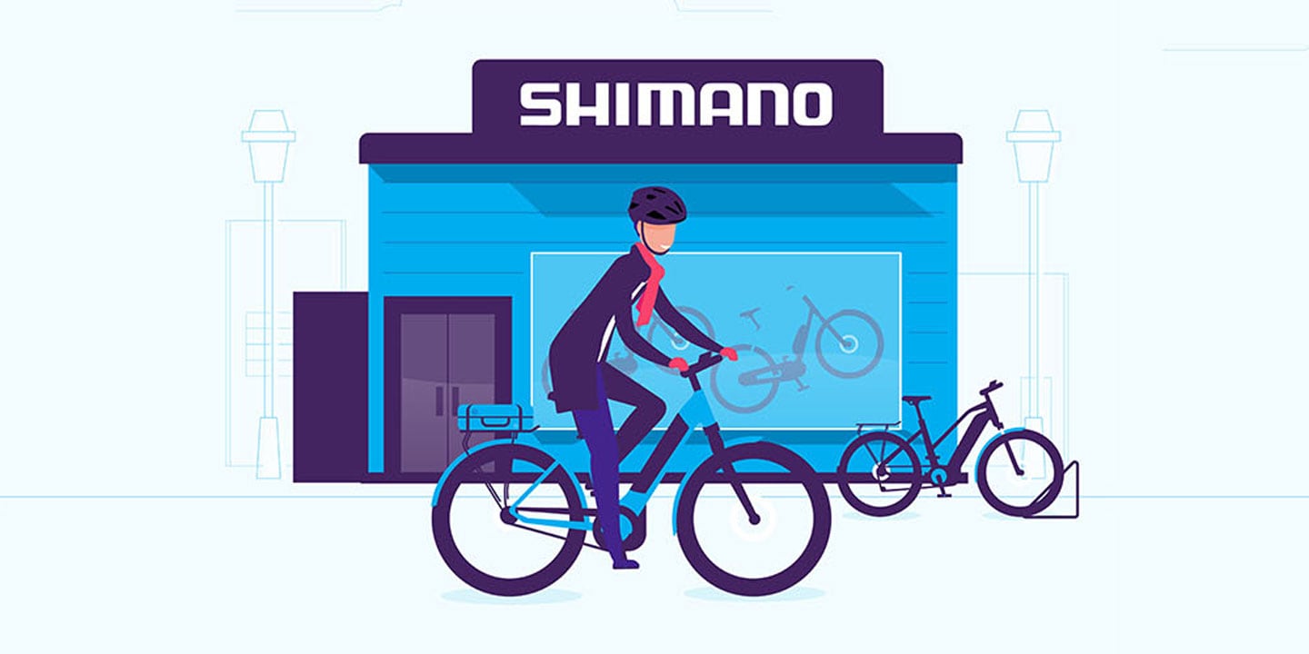 Illustration of a person riding a bicycle in front of a Shimano store