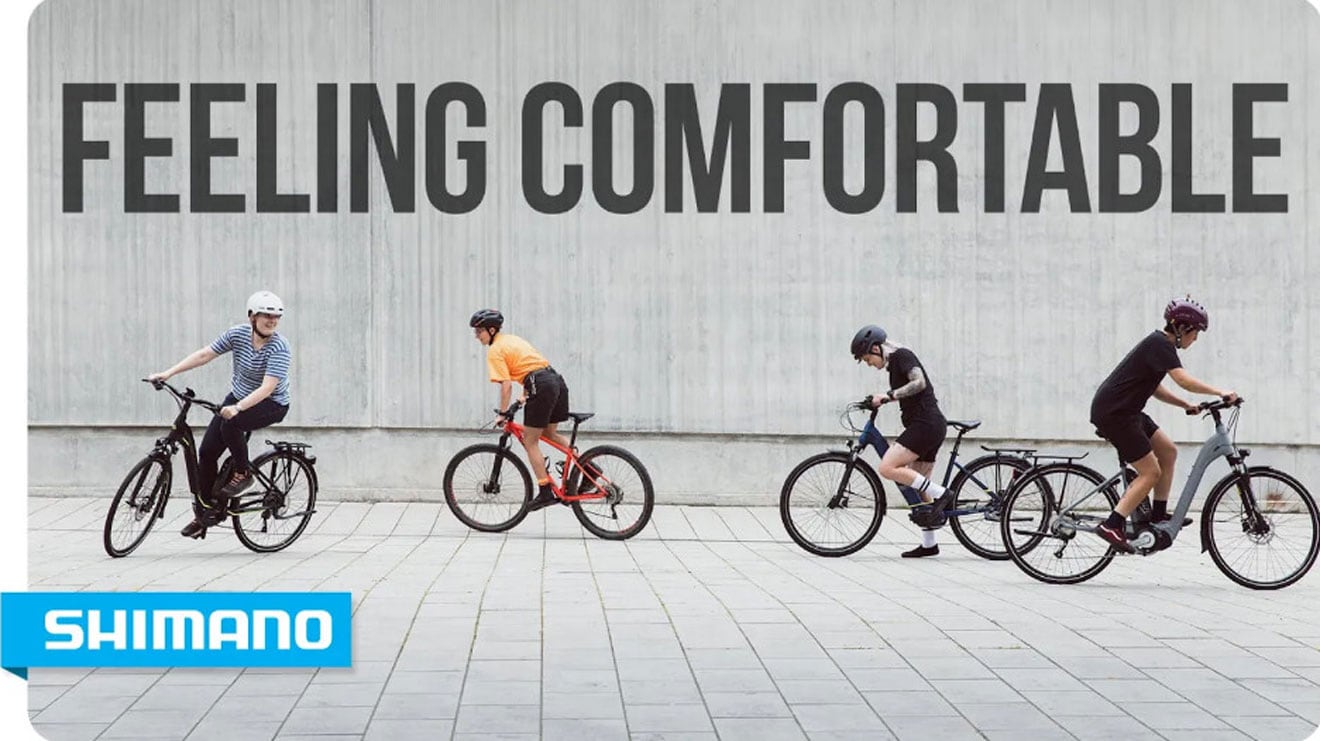 Four cyclists riding with text 'Feeling Comfortable' and Shimano logo in the corner