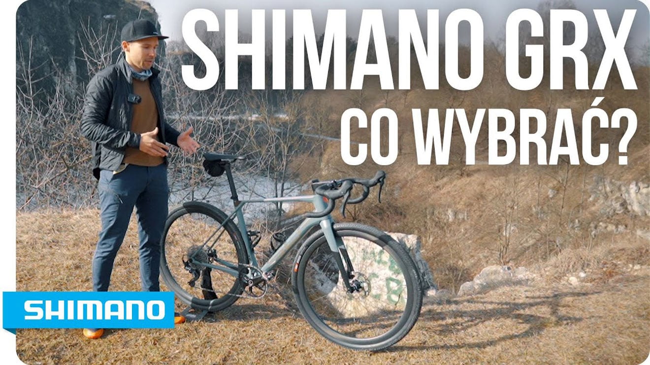 Mężczyzna z rowerem w plenerze, z napisem Shimano GRX nałożonym na obraz.