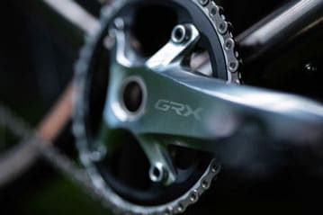 Close-up of a GRX bicycle crankset and chainring