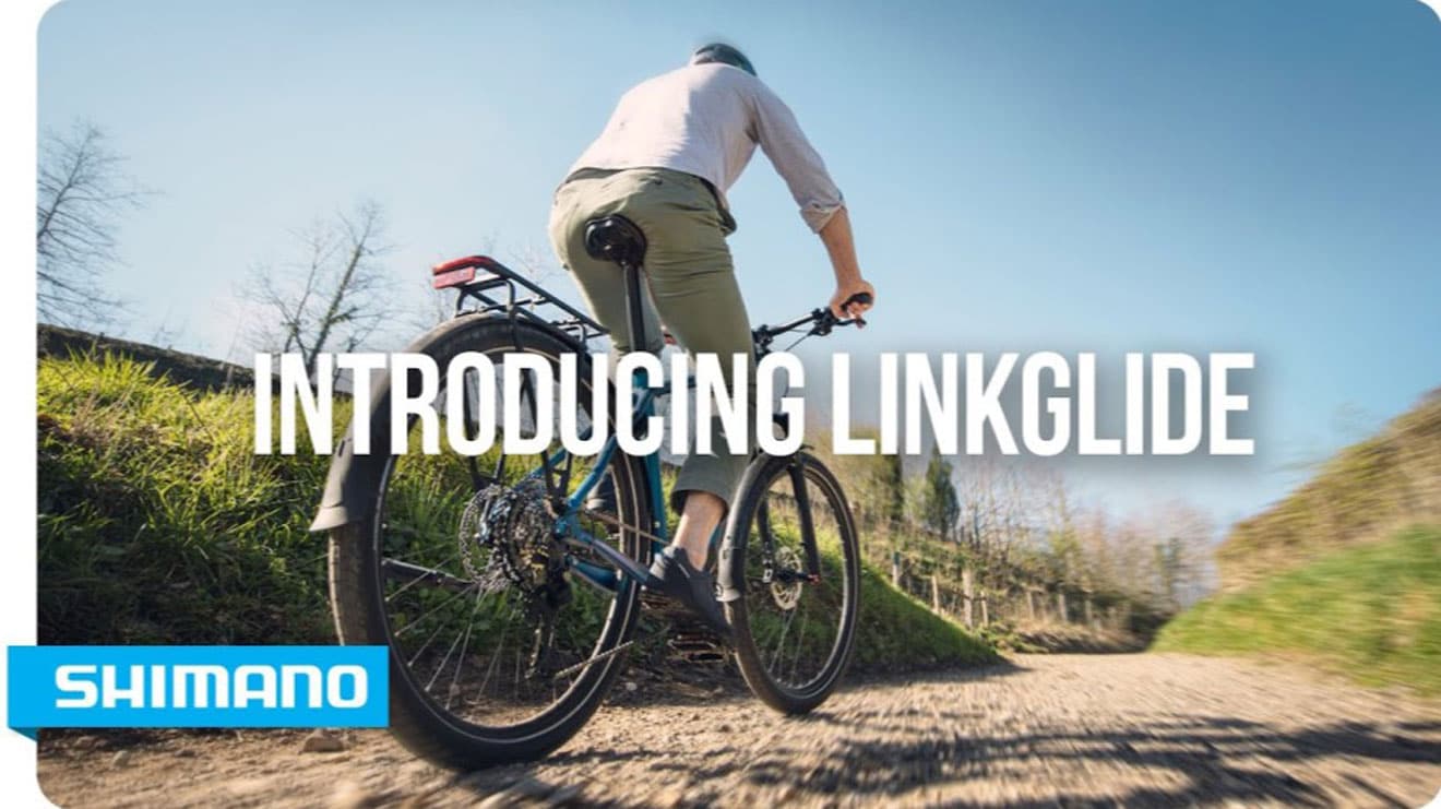 Cycliste sur un sentier avec le texte "Introducing Linkglide" et le logo Shimano.