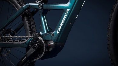 Close-up of Orbea bicycle frame and components with dark background