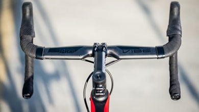 Close-up of a bicycle's drop handlebars with Pro Vibe branding