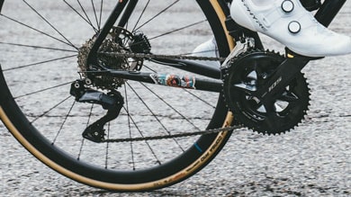 Person adjusting bicycle gears via phone app