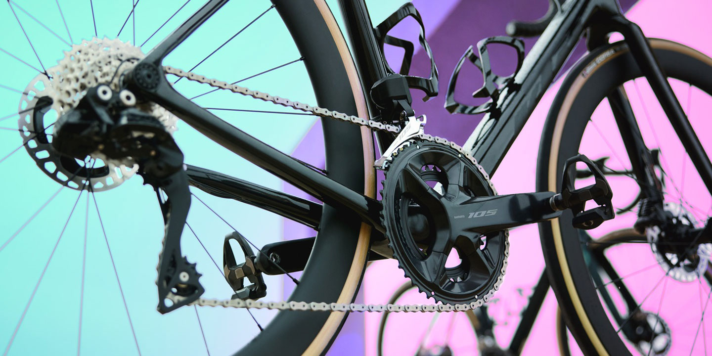 Close-up of a bicycle drivetrain with colorful background