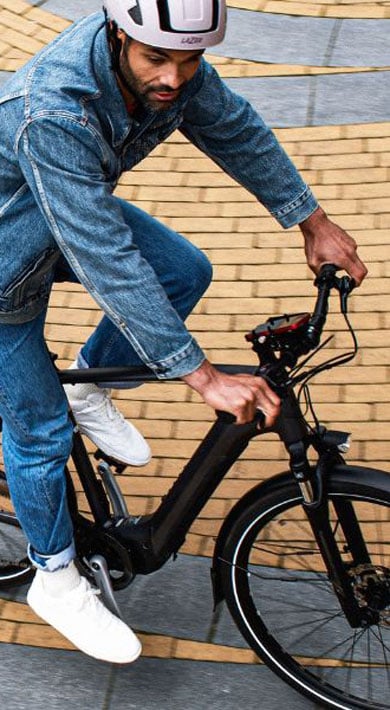 Person riding a bicycle on a circular brick path