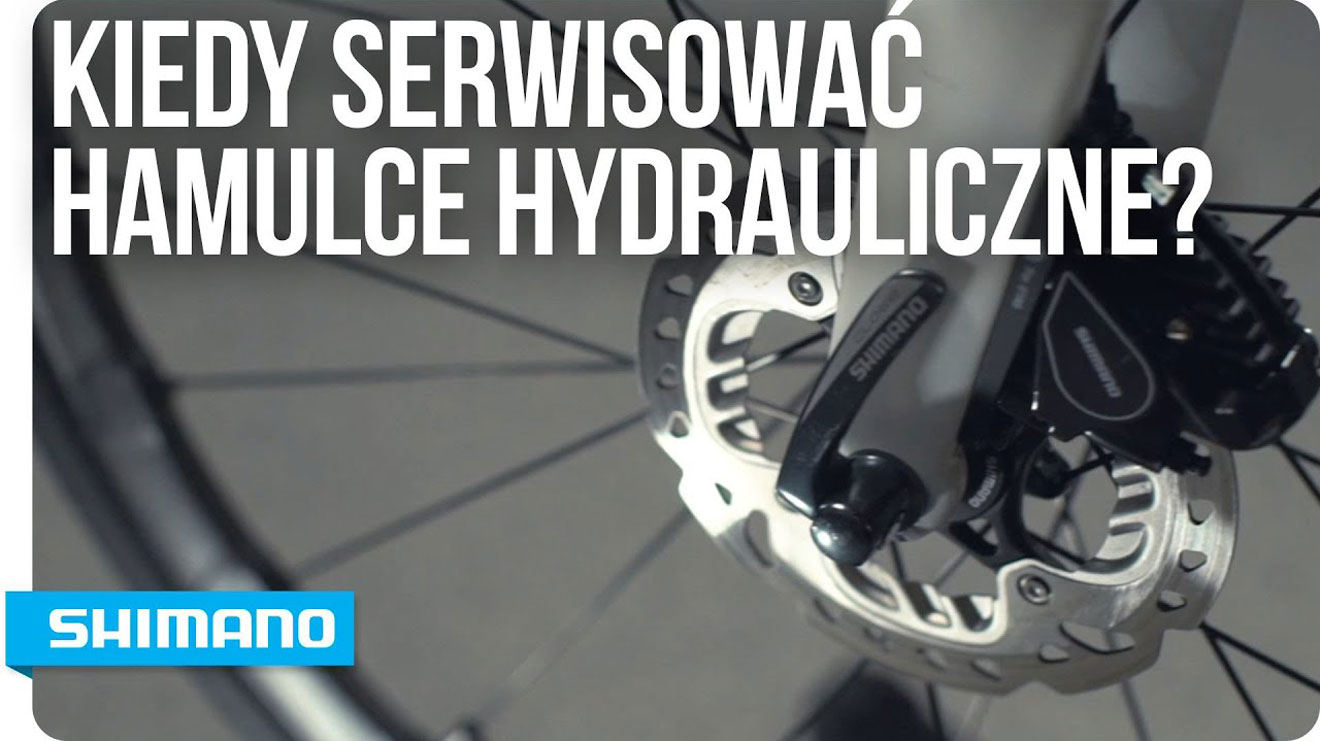 Zbliżenie hydraulicznego hamulca Shimano z polskim napisem.