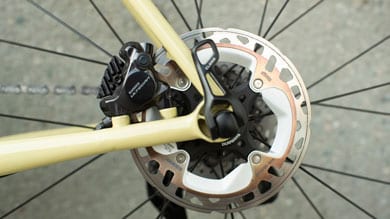 Close-up of bicycle disc brake and rotor