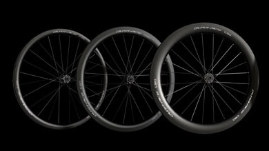 Three Shimano Dura-Ace C36, C50, and C60 bike wheels against a black background