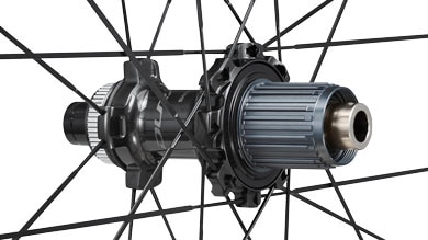 Close-up of a bicycle hub with spokes and a detailed freehub body