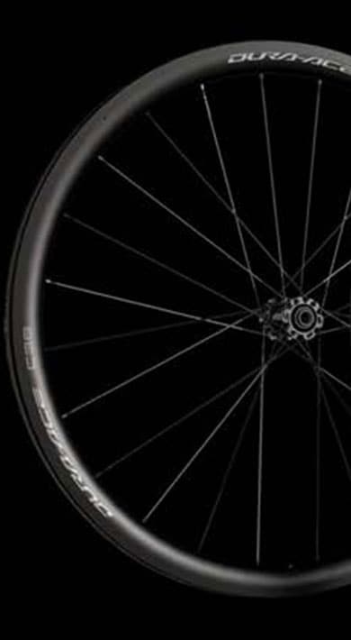 Three bicycle wheels with Dura-Ace C60 branding against a black background