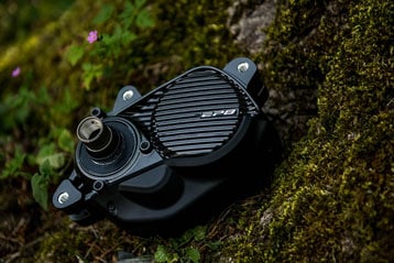 Black EP8 motor on mossy rock background