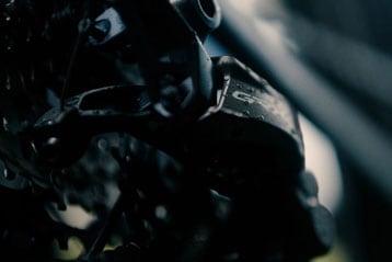 Close-up of a bicycle gear with water droplets