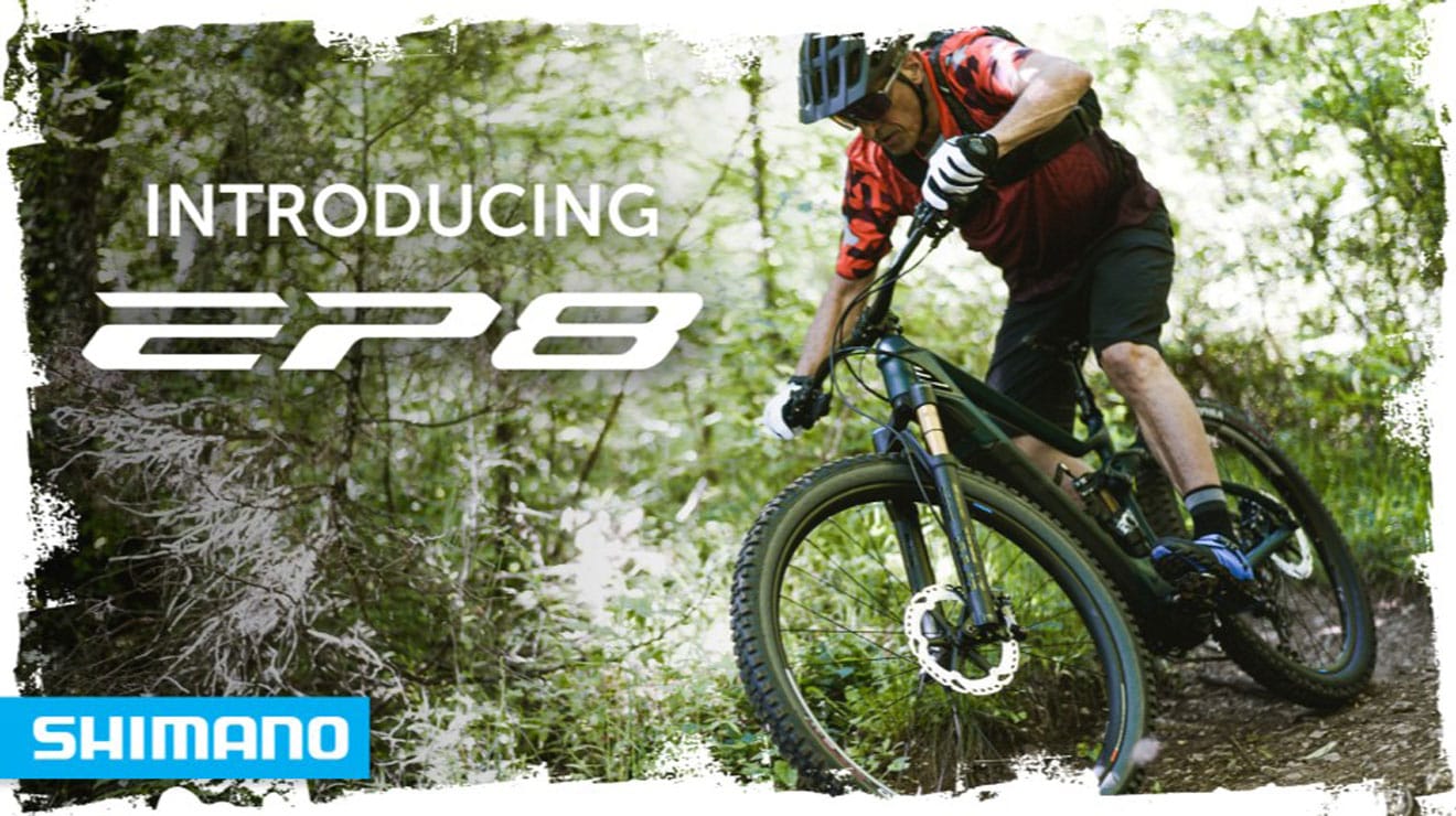 Cyclist riding mountain bike through forest, text: Introducing EP8, Shimano logo in corner