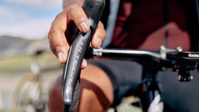 Cyclist's hand holding Ultegra bike brake lever