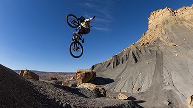 Shimano MTB Athlete Vaea Verbeek doing a no hander on her mountain bike Red Bull Rampage Women