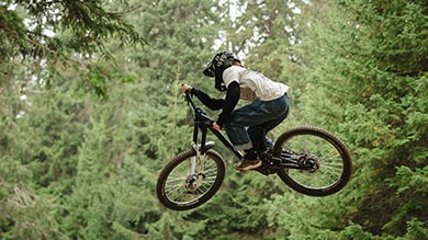 Shimano Freeride athlete Vinny Armstrong jumping her downhill mountain bike Red Bull Rampage Women 2024