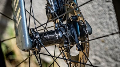 Close-up of a bicycle wheel hub with disc brake rotor