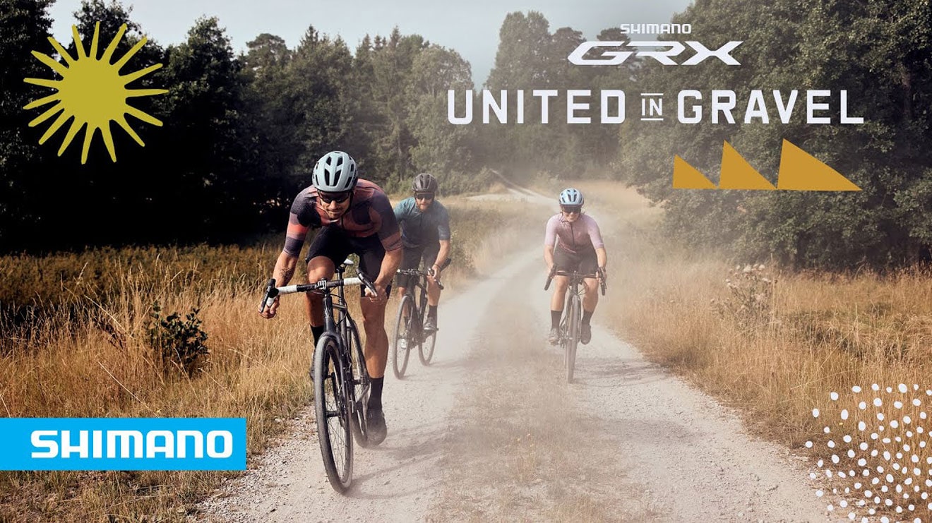 Cyclists riding on a gravel path in a forest, promoting Shimano GRX with the text United in Gravel.