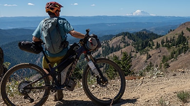 Kurt Refsnider siding on his bike taking in the view on the Orogenesis trail riding Shimano Deore XT Di2