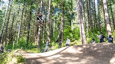 Yeti/Shimano Enduro race team rider JT Fisher hitting a large hip at North west Tune-Up Festival