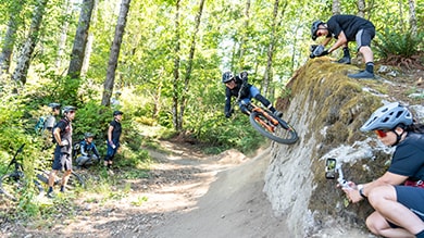 Jill Kintner hitting a rock wall ride during the shimano group ride at the north west tune-up