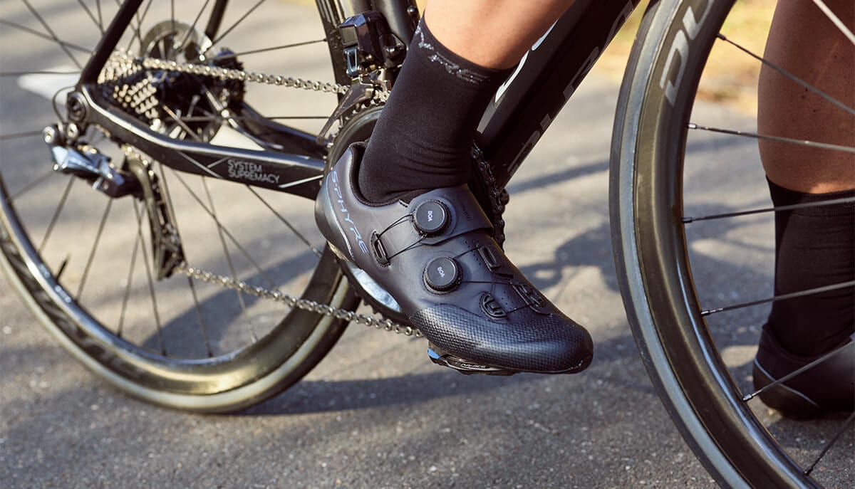 Black Shimano RC902 road bike shoes paired with a Shimano DURA-ACE road bike